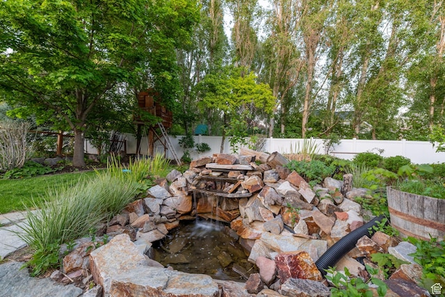 6208 W Bull River Rd, Highland, UT 84003 - view of patio / terrace with a garden pond and a fenced backyard