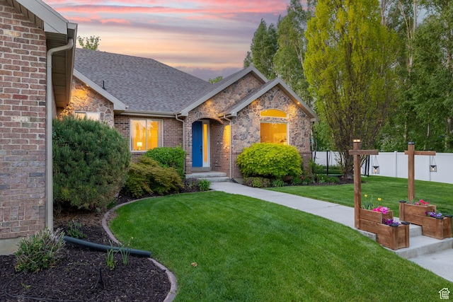 6208 W Bull River Rd, Highland, UT 84003 - view of front of home featuring stone siding, brick siding, and a shingled roof