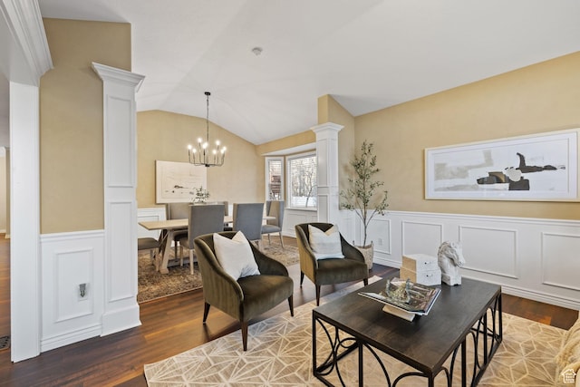 6208 W Bull River Rd, Highland, UT 84003 - living room with ornate columns, wood finished floors, a chandelier, a wainscoted wall, and a decorative wall