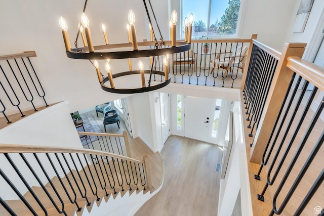 881 S 635 W, Orem, UT 84058 - entrance foyer with wood finished floors, stairway, and an inviting chandelier