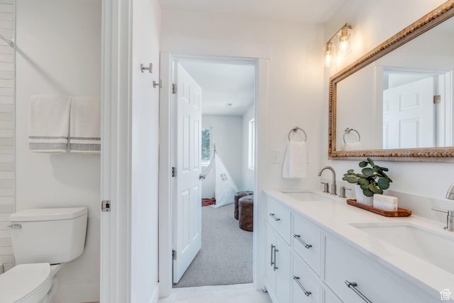 881 S 635 W, Orem, UT 84058 - ensuite bathroom featuring double vanity, a sink, toilet, and ensuite bath