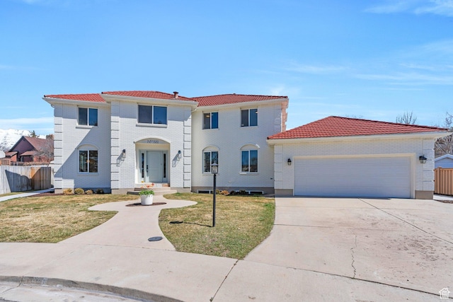 881 S 635 W, Orem, UT 84058 - mediterranean / spanish home featuring a tile roof, fence, driveway, a front yard, and a garage
