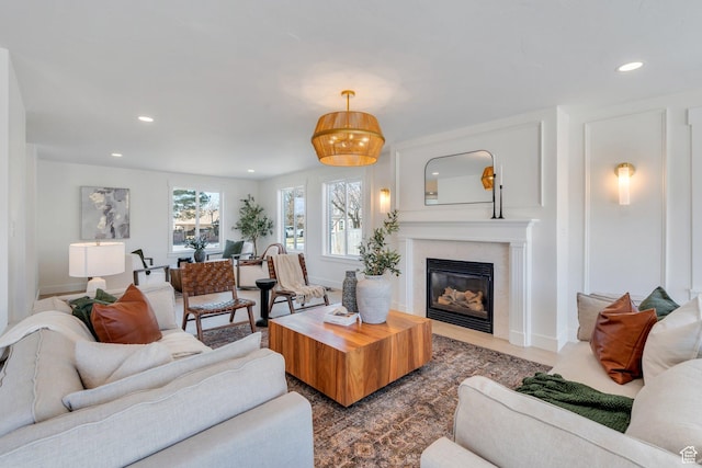 881 S 635 W, Orem, UT 84058 - living room with baseboards, a glass covered fireplace, and recessed lighting