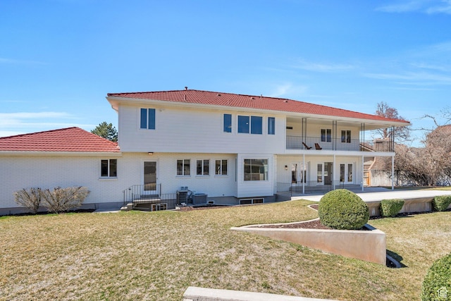 881 S 635 W, Orem, UT 84058 - rear view of house with a balcony, a lawn, a patio, and central AC