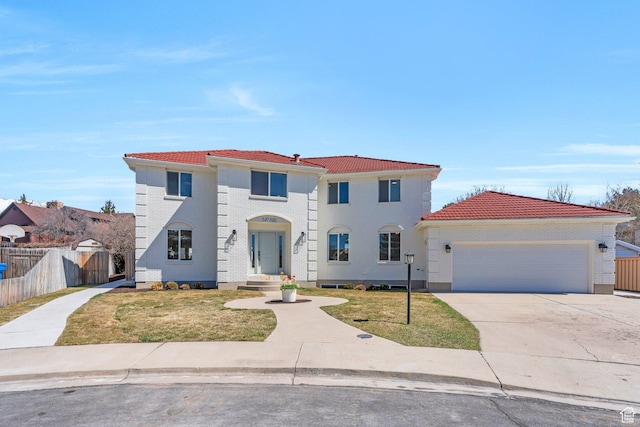 881 S 635 W, Orem, UT 84058 - mediterranean / spanish-style home with a front yard, driveway, a garage, and fence