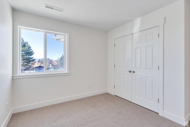 881 S 635 W, Orem, UT 84058 - unfurnished bedroom with baseboards, carpet floors, visible vents, and a closet