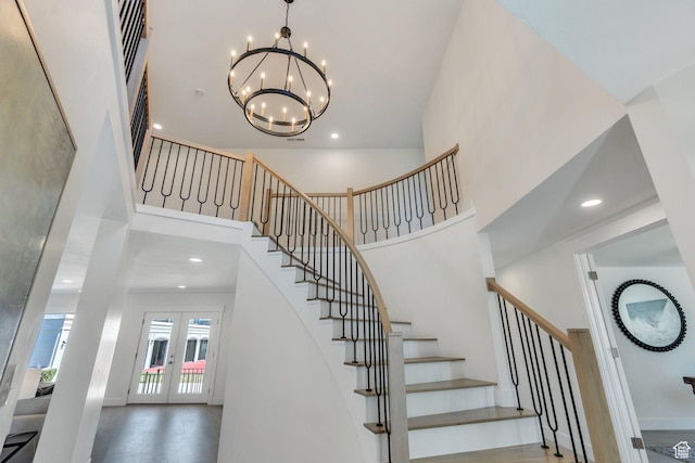 881 S 635 W, Orem, UT 84058 - stairs with a towering ceiling, recessed lighting, an inviting chandelier, and french doors