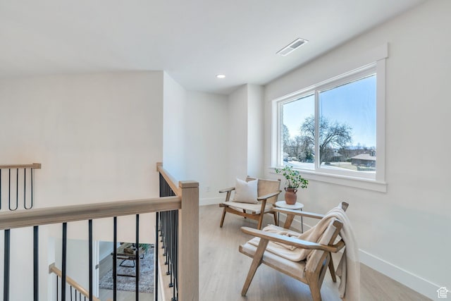 881 S 635 W, Orem, UT 84058 - sitting room with baseboards, visible vents, an upstairs landing, and wood finished floors