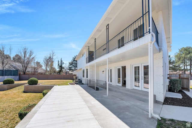 881 S 635 W, Orem, UT 84058 - view of patio / terrace with french doors, a balcony, and fence