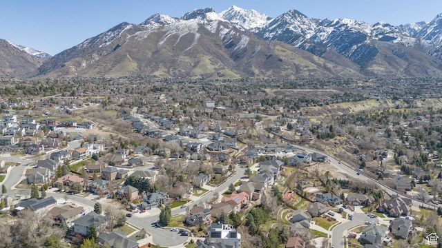 birds eye view of property with a mountain view and a residential view