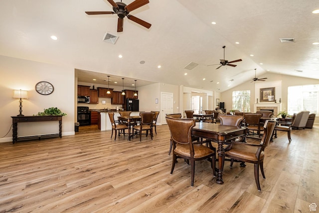 1886 S 830 W Unit D, Syracuse, UT 84075 - dining area featuring high vaulted ceiling, visible vents, light wood-style floors, and a ceiling fan