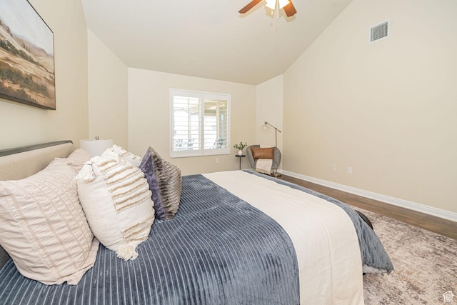 1886 S 830 W Unit D, Syracuse, UT 84075 - bedroom featuring wood finished floors, baseboards, vaulted ceiling, and visible vents