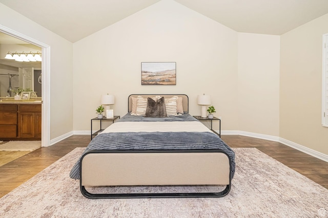 1886 S 830 W Unit D, Syracuse, UT 84075 - bedroom with baseboards, lofted ceiling, ensuite bathroom, and wood finished floors