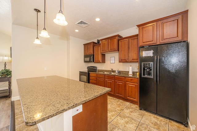1886 S 830 W Unit D, Syracuse, UT 84075 - kitchen featuring a sink, visible vents, light stone countertops, black appliances, and brown cabinets