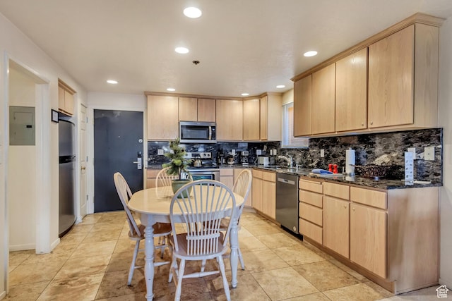 255 Main St Unit A2, Park City, UT 84060 - kitchen with recessed lighting, stainless steel appliances, decorative backsplash, light brown cabinets, and electric panel