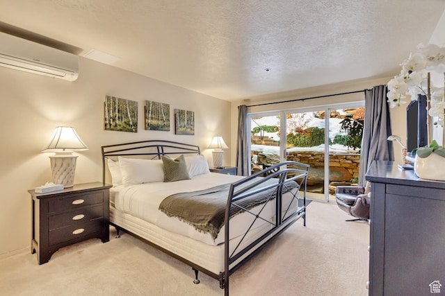 255 Main St Unit A2, Park City, UT 84060 - bedroom with light carpet, a textured ceiling, a wall unit AC, and access to outside