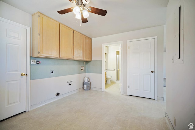 laundry area featuring cabinet space, ceiling fan, hookup for an electric dryer, and light floors