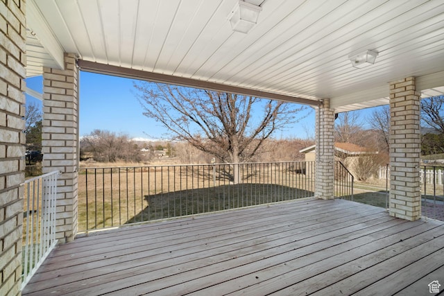wooden deck featuring fence