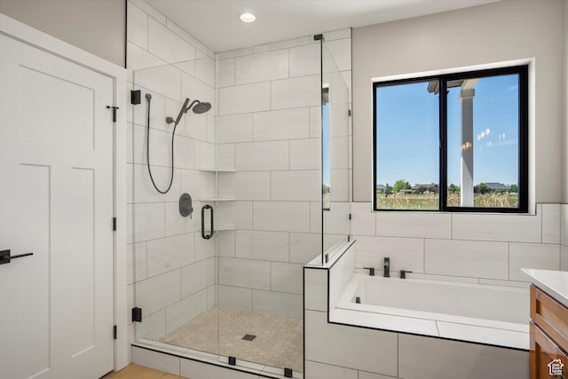 2833 N 3475 W, Plain City, UT 84404 - full bathroom featuring a shower stall, a garden tub, vanity, and recessed lighting