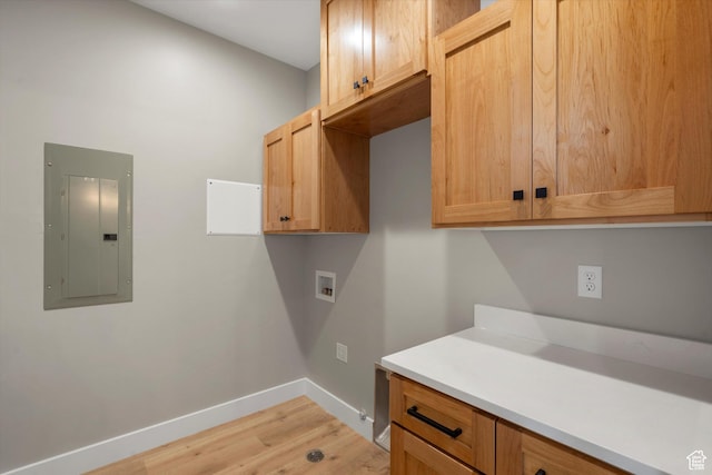 2833 N 3475 W, Plain City, UT 84404 - laundry room featuring electric panel, cabinet space, baseboards, washer hookup, and light wood finished floors