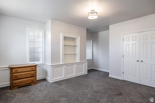 67 E Dorchester Dr, Salt Lake City, UT 84103 - unfurnished bedroom featuring a closet and dark colored carpet