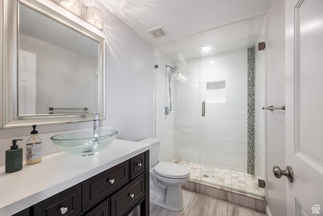 67 E Dorchester Dr, Salt Lake City, UT 84103 - full bathroom with a stall shower, visible vents, toilet, and vanity
