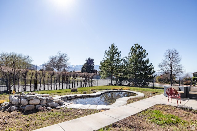 67 E Dorchester Dr, Salt Lake City, UT 84103 - view of home's community with a fenced backyard, a lawn, and a patio
