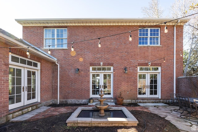 67 E Dorchester Dr, Salt Lake City, UT 84103 - rear view of house featuring french doors, brick siding, and a patio
