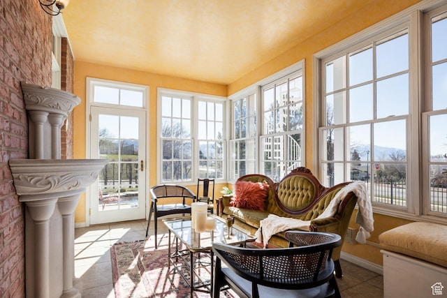 67 E Dorchester Dr, Salt Lake City, UT 84103 - sunroom with tile patterned floors, baseboards, and brick wall