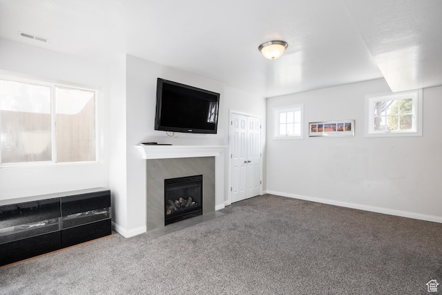 67 E Dorchester Dr, Salt Lake City, UT 84103 - unfurnished living room with baseboards, visible vents, a high end fireplace, and carpet