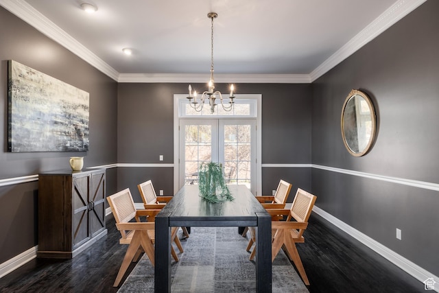 67 E Dorchester Dr, Salt Lake City, UT 84103 - dining room with ornamental molding, dark wood-style flooring, a notable chandelier, and baseboards