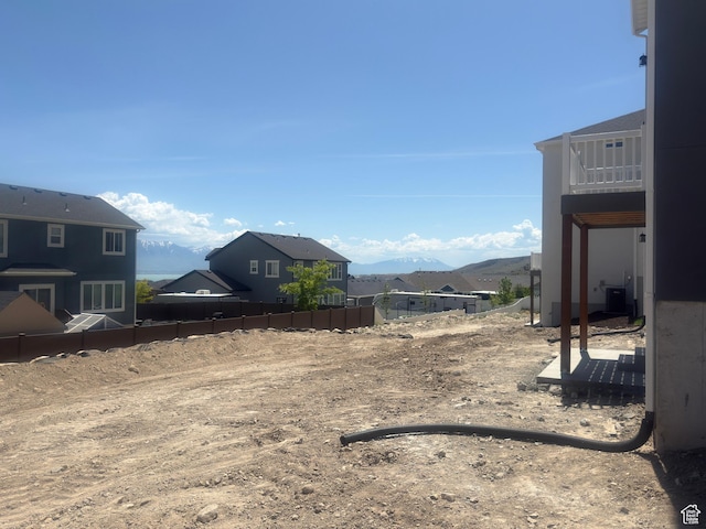7326 N Long Ridge Dr Unit 614, Eagle Mountain, UT 84005 - view of yard featuring a mountain view, a balcony, central AC unit, and a residential view
