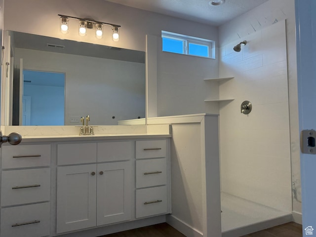 7326 N Long Ridge Dr Unit 614, Eagle Mountain, UT 84005 - bathroom featuring a walk in shower and vanity