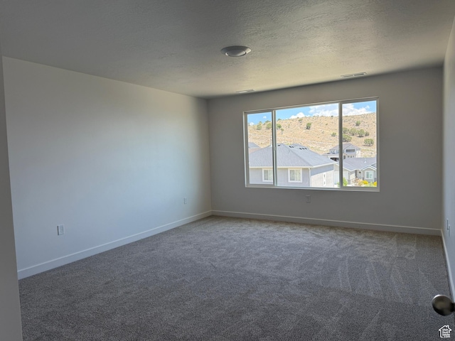7326 N Long Ridge Dr Unit 614, Eagle Mountain, UT 84005 - empty room with carpet flooring, a textured ceiling, and baseboards