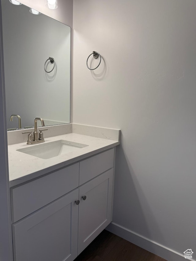 7326 N Long Ridge Dr Unit 614, Eagle Mountain, UT 84005 - bathroom with vanity, baseboards, and wood finished floors
