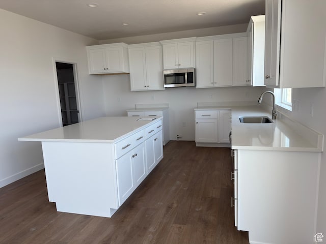 7326 N Long Ridge Dr Unit 614, Eagle Mountain, UT 84005 - kitchen with stainless steel microwave, a sink, dark wood-style flooring, white cabinetry, and recessed lighting