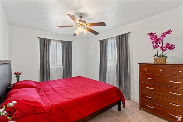379 S Utah Dr, Grantsville, UT 84029 - bedroom featuring light carpet, baseboards, and ceiling fan