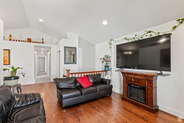 379 S Utah Dr, Grantsville, UT 84029 - living area featuring baseboards, lofted ceiling, wood finished floors, and recessed lighting