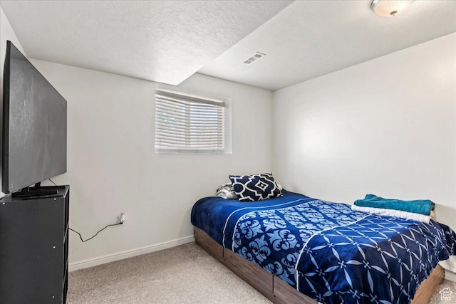 379 S Utah Dr, Grantsville, UT 84029 - carpeted bedroom featuring a textured ceiling, baseboards, and visible vents