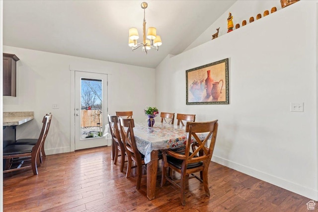 379 S Utah Dr, Grantsville, UT 84029 - dining space featuring an inviting chandelier, baseboards, vaulted ceiling, and wood-type flooring