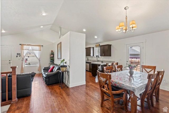 379 S Utah Dr, Grantsville, UT 84029 - dining space with baseboards, an inviting chandelier, recessed lighting, vaulted ceiling, and wood-type flooring