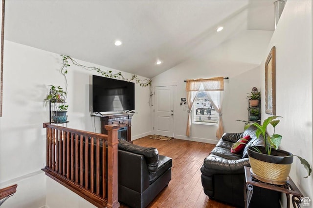 379 S Utah Dr, Grantsville, UT 84029 - living area featuring wood-type flooring, baseboards, lofted ceiling, and recessed lighting