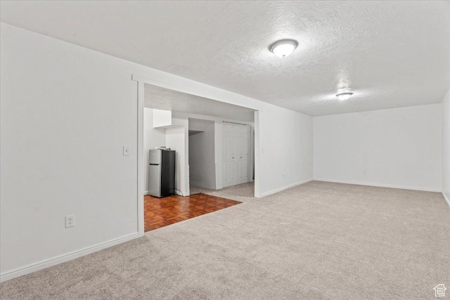 379 S Utah Dr, Grantsville, UT 84029 - carpeted empty room featuring baseboards and a textured ceiling