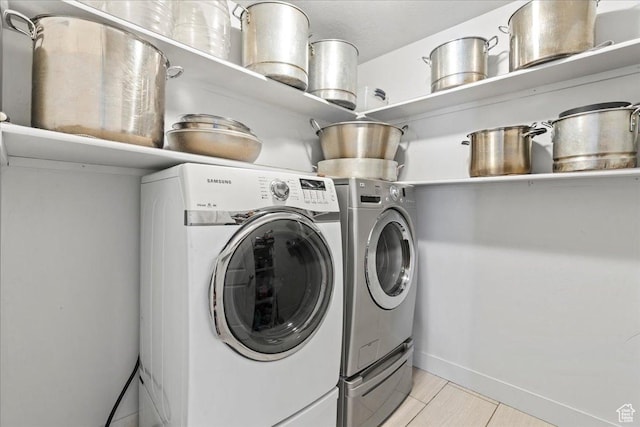 379 S Utah Dr, Grantsville, UT 84029 - laundry area with baseboards, washing machine and clothes dryer, and laundry area