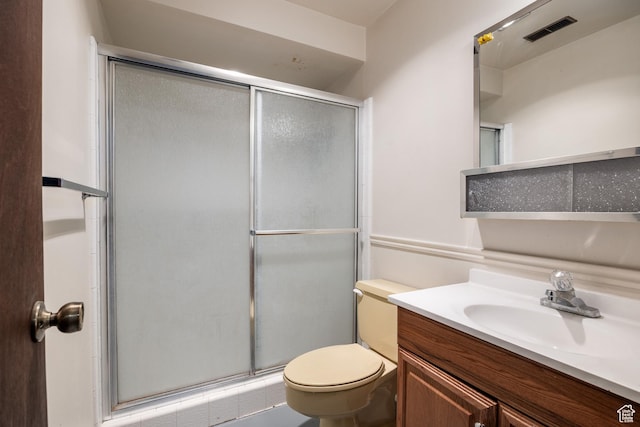 full bathroom with visible vents, a stall shower, toilet, and vanity