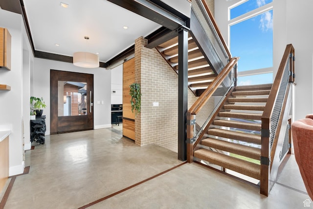 4601 N Toscana Hills Dr, Lehi, UT 84043 - staircase featuring baseboards, a towering ceiling, recessed lighting, and finished concrete floors