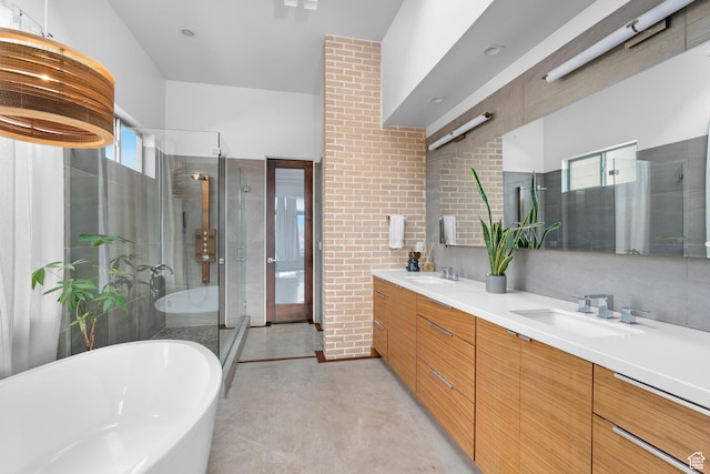 4601 N Toscana Hills Dr, Lehi, UT 84043 - full bath with finished concrete flooring, a freestanding tub, a shower stall, a sink, and double vanity