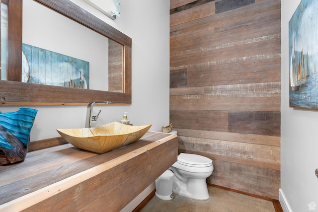 4601 N Toscana Hills Dr, Lehi, UT 84043 - bathroom with toilet, a sink, and wooden walls