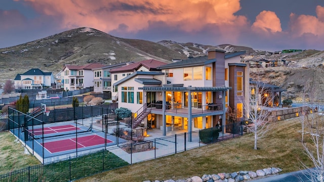 4601 N Toscana Hills Dr, Lehi, UT 84043 - back of house with fence, a lawn, a patio area, a tennis court, and a chimney