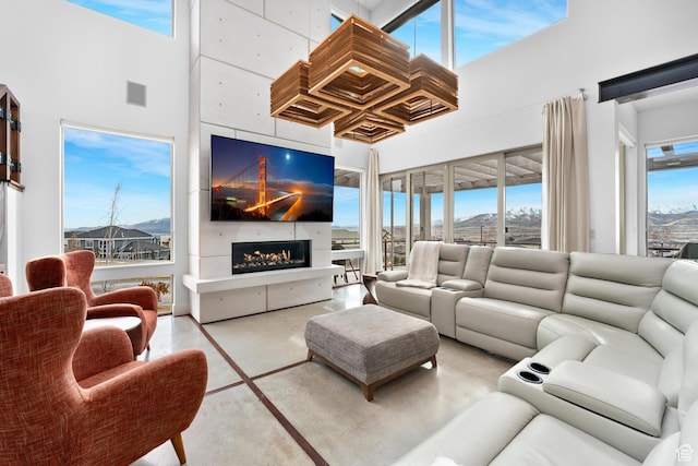 4601 N Toscana Hills Dr, Lehi, UT 84043 - living room featuring visible vents, a high ceiling, and a fireplace